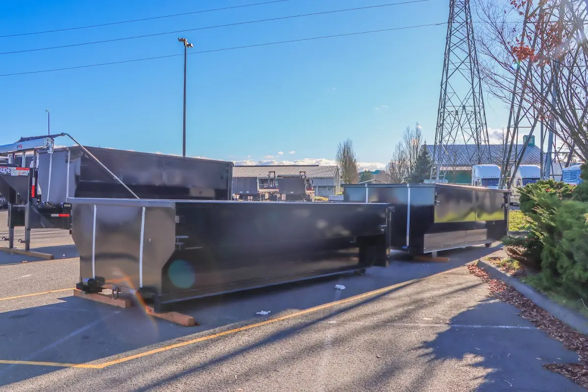 Roll-off dumpster ready for waste disposal at job site for Construction Dumpster Rental in Chippewa Falls